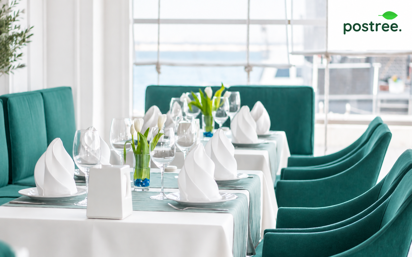 A restaurant table elegantly set with linen and glassware, ready for the next service